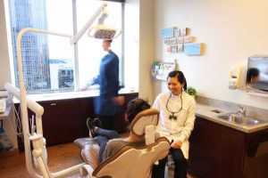 doctor jenny nguyen provides dental care to a patient