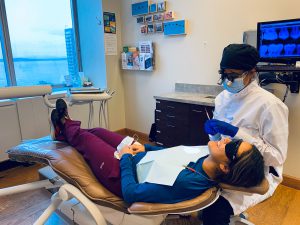 doctor asmeret tesfahun providing dental care to a patient in our comfortable and relaxed setting